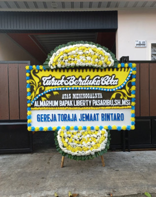 Papan Bunga Duka di Kakaskasen Tiga